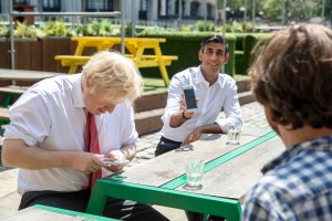 Former PM Boris Johnson and new PM Rishi Sunak on their phones