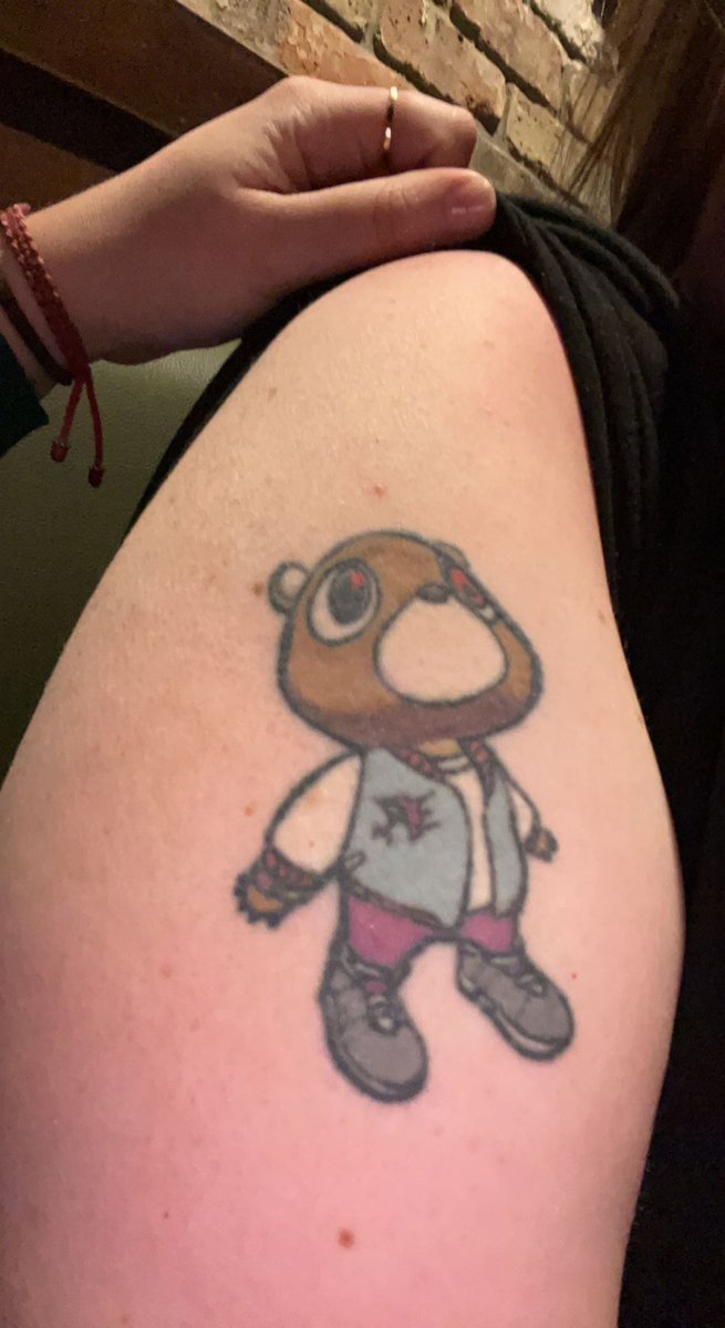 Forearm tattoo of Kanye West's Graduation bear