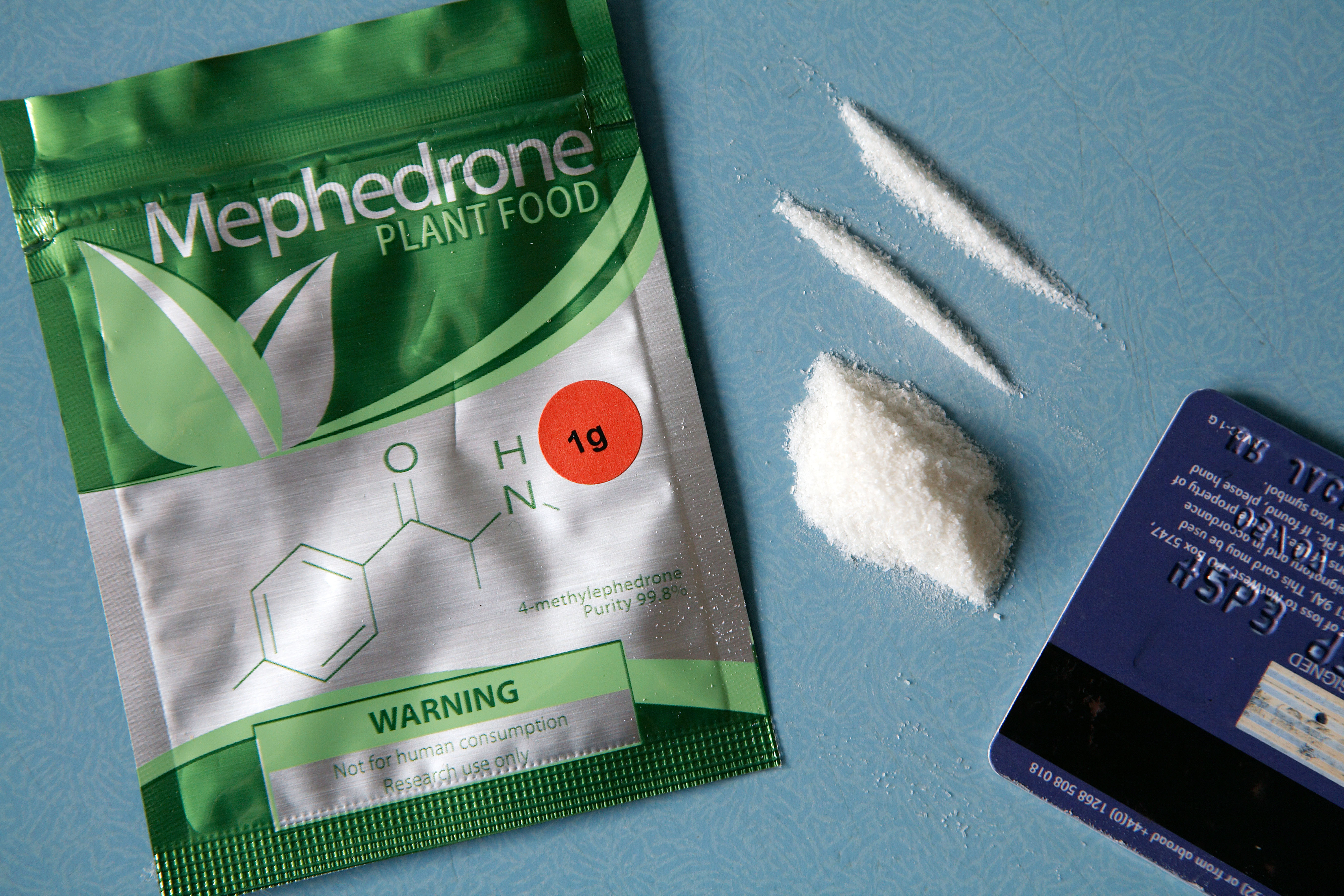 Mephedrone in plant food packaging with lines cut up next to it