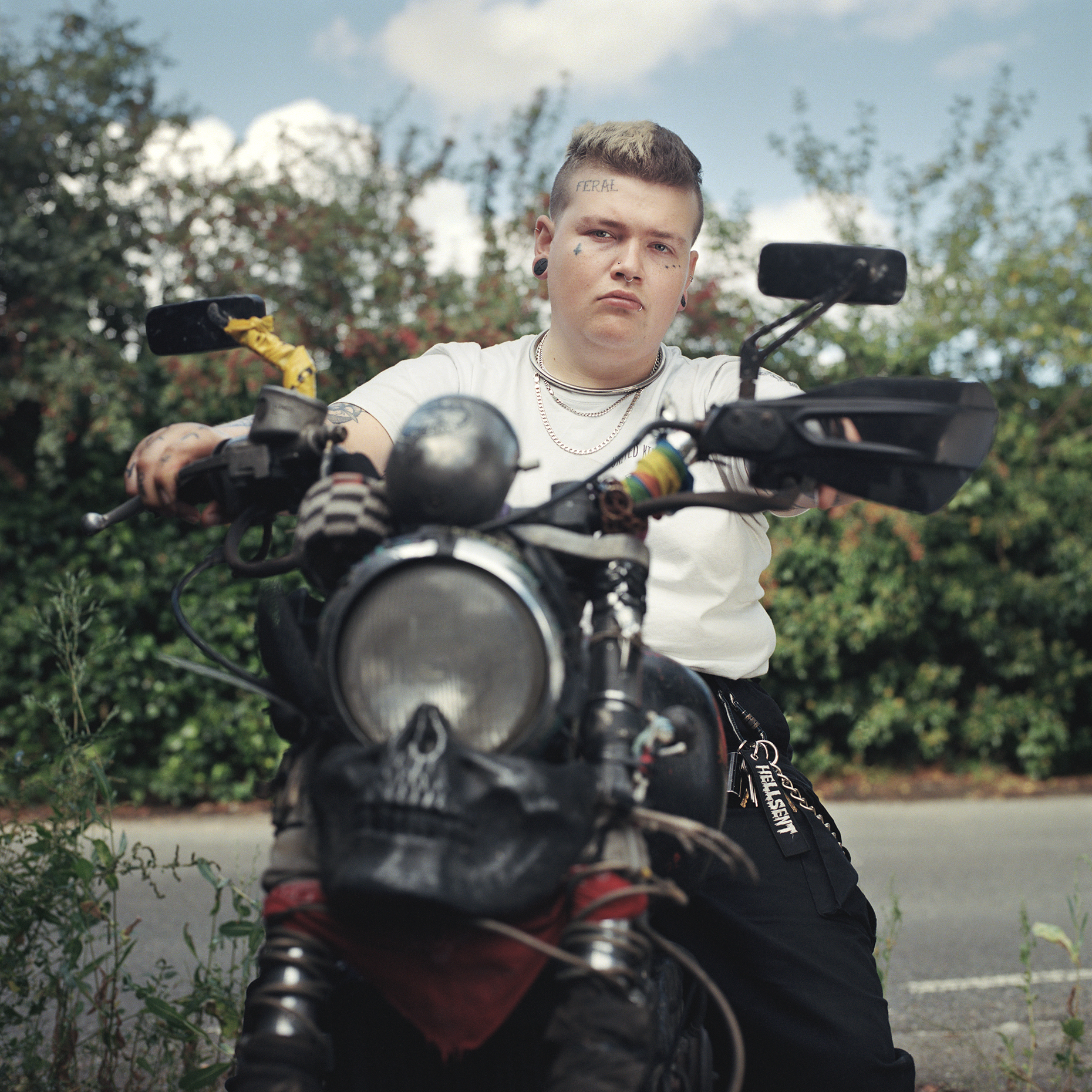 Gideon, East Farleigh, Kent: A butch lesbian with face tatts on a motorbike