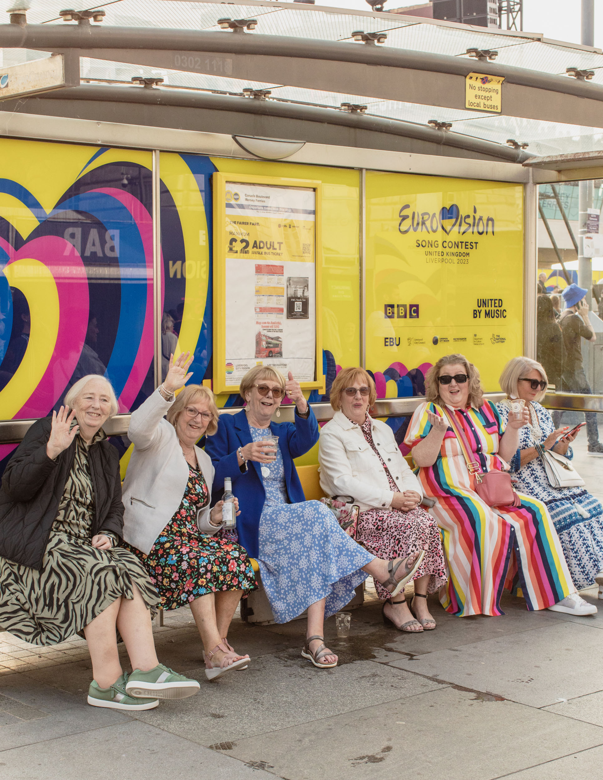 Eurovision 2023 in Liverpool: Older women at a Eurovision themed bus stop