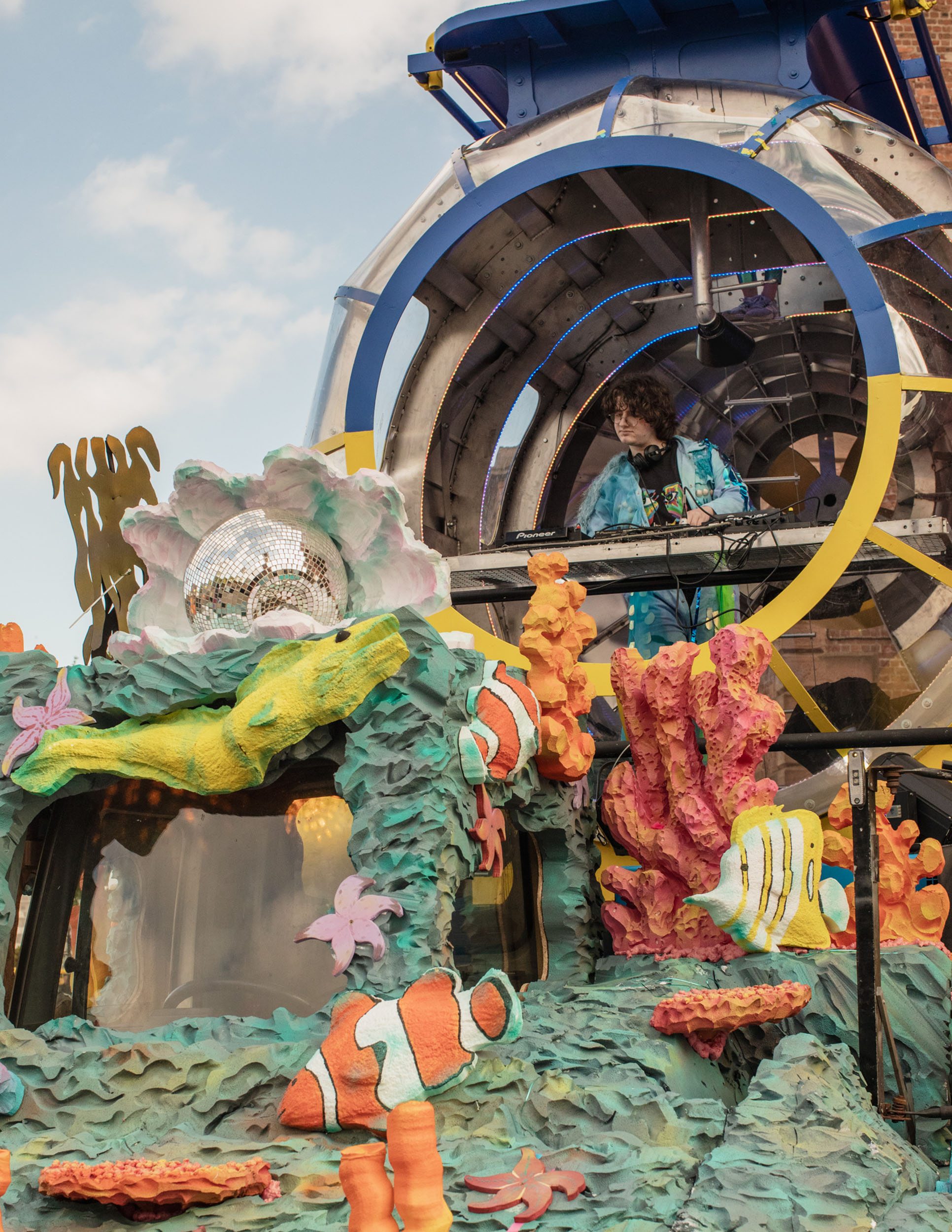 Eurovision 2023 in Liverpool: A DJ playing in a yellow submarine stage
