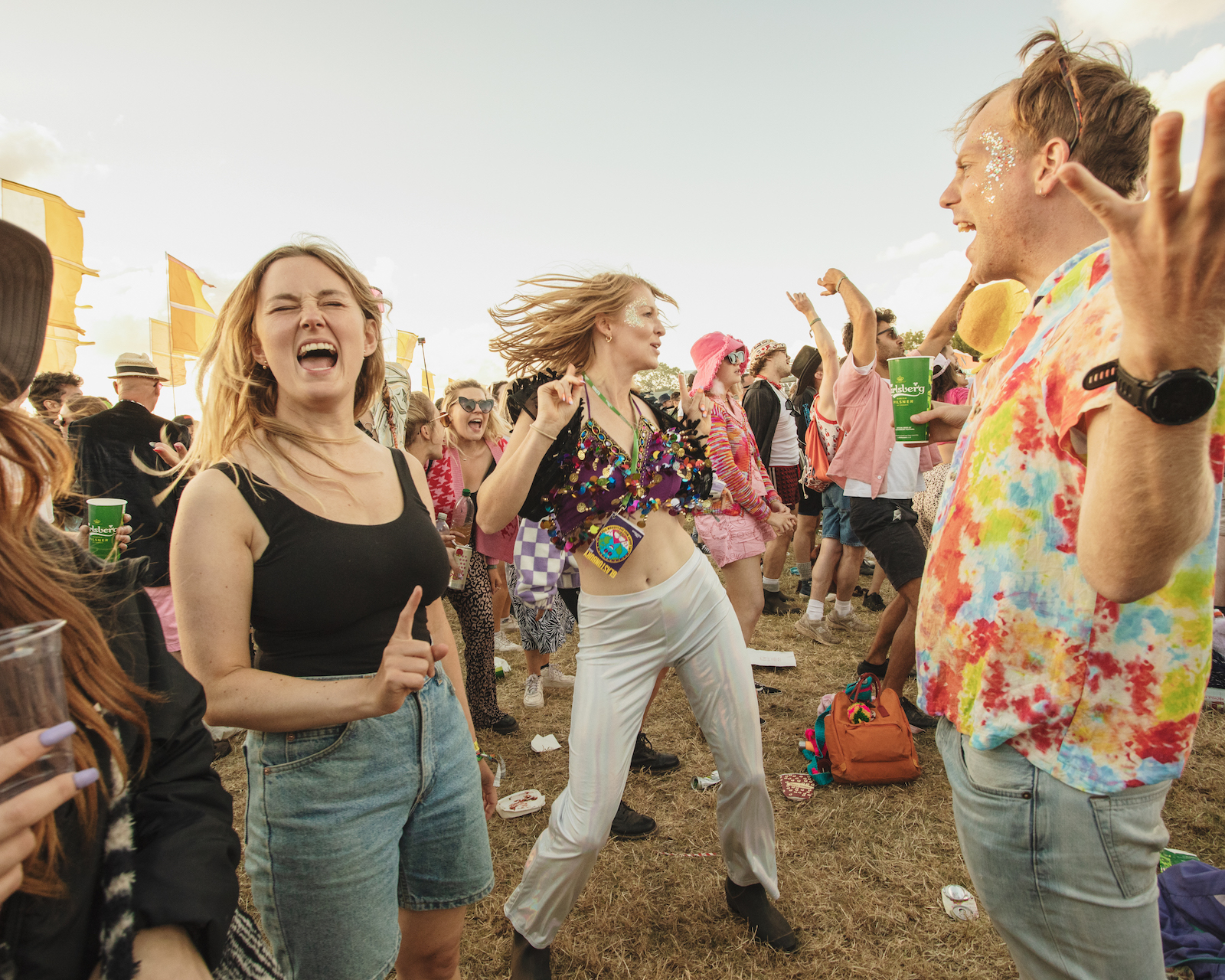 Women dancing in the crowd at Glastonbury. Photo by Chris Bethell.
