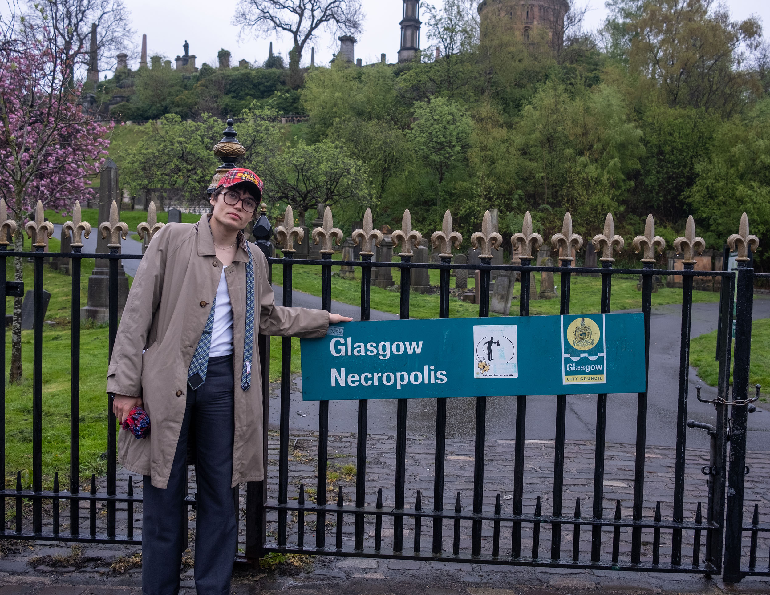 A man in glasses outside Glasgow Necropolis in early morning hours