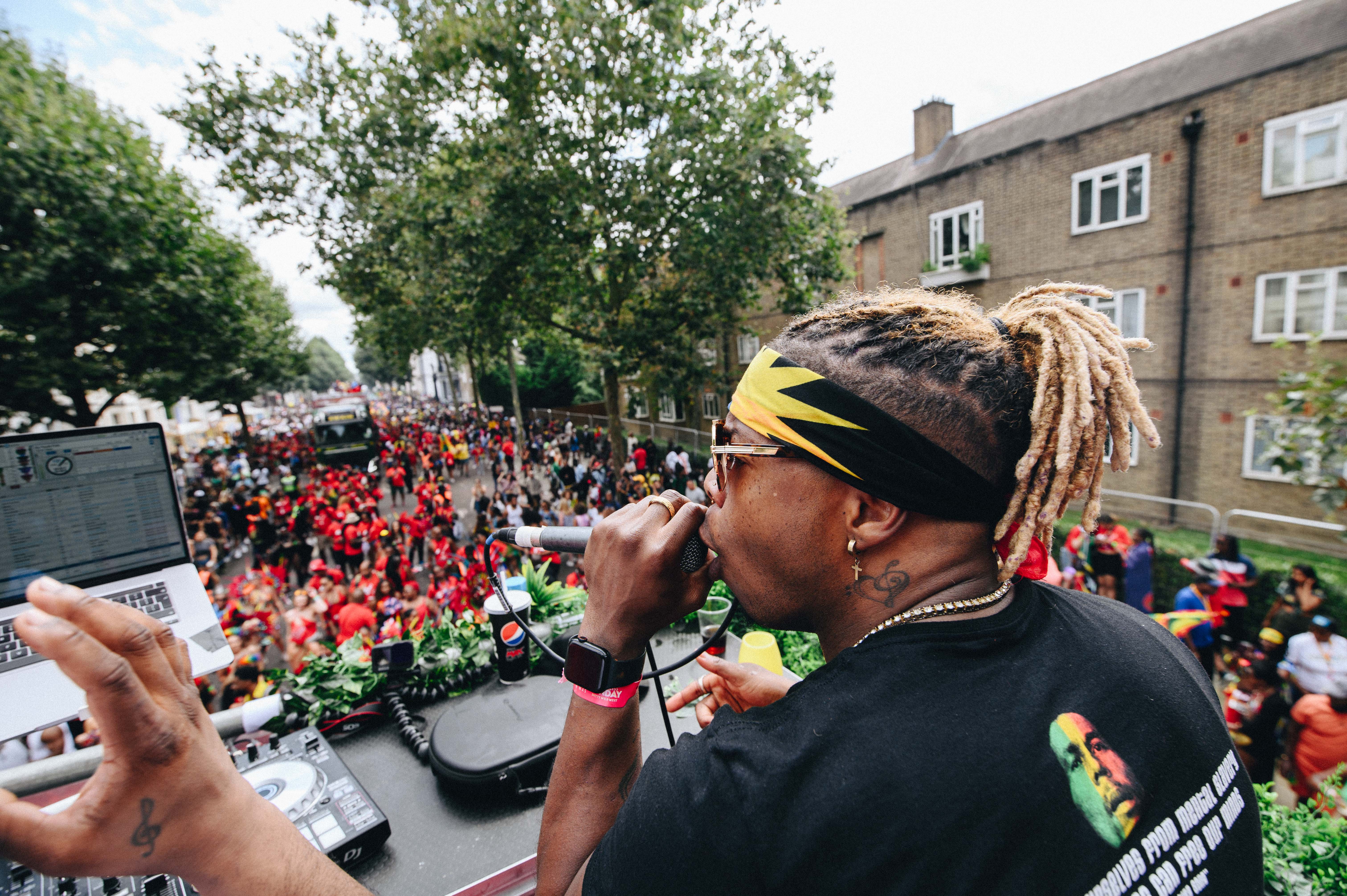 Notting Hill Carnival 2023, London: An emcee on the mic at a soundsystem