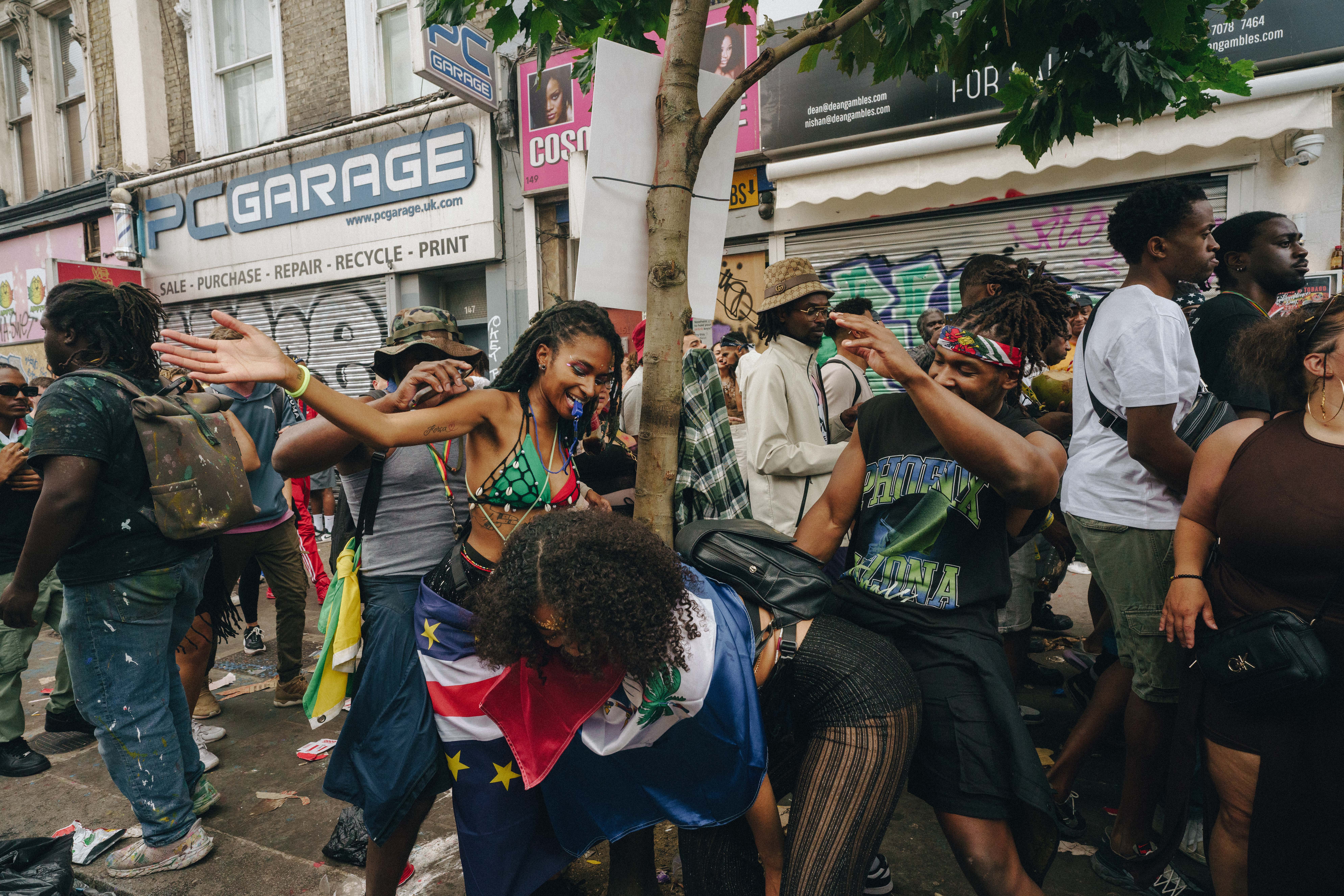 Notting Hill Carnival 2023, London: A group of young people dancing and smiling