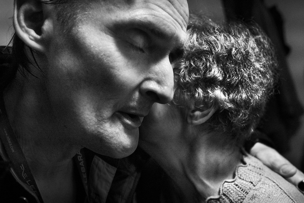 Mikkel Hørlyck, Jørgen, a Mystery – close up of a man and woman hugging. Pedersen is missing his teeth, his face is emaciated