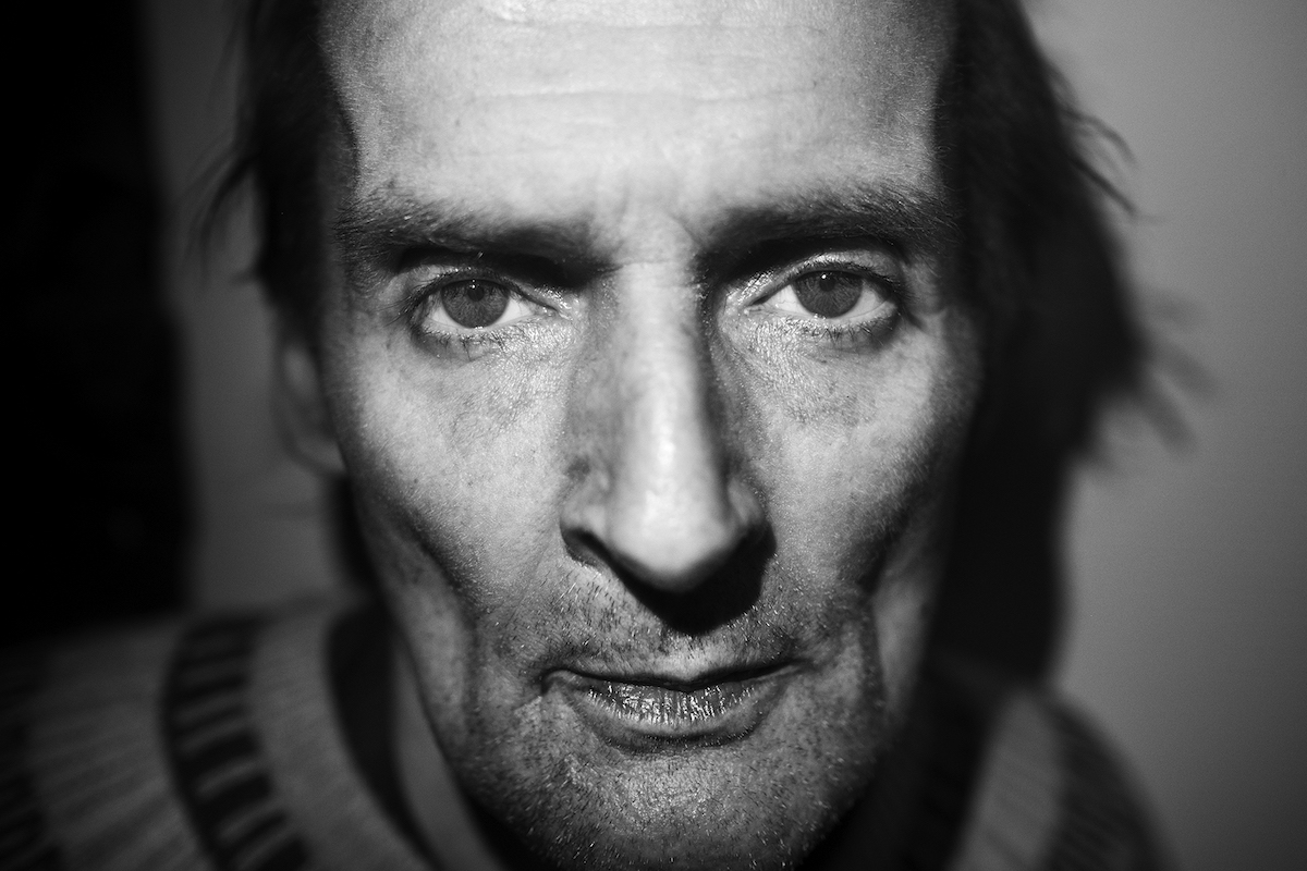 Mikkel Hørlyck, Jørgen, a Mystery – close-up frontal shot of a man with an emaciated face, looking wearily at camera.