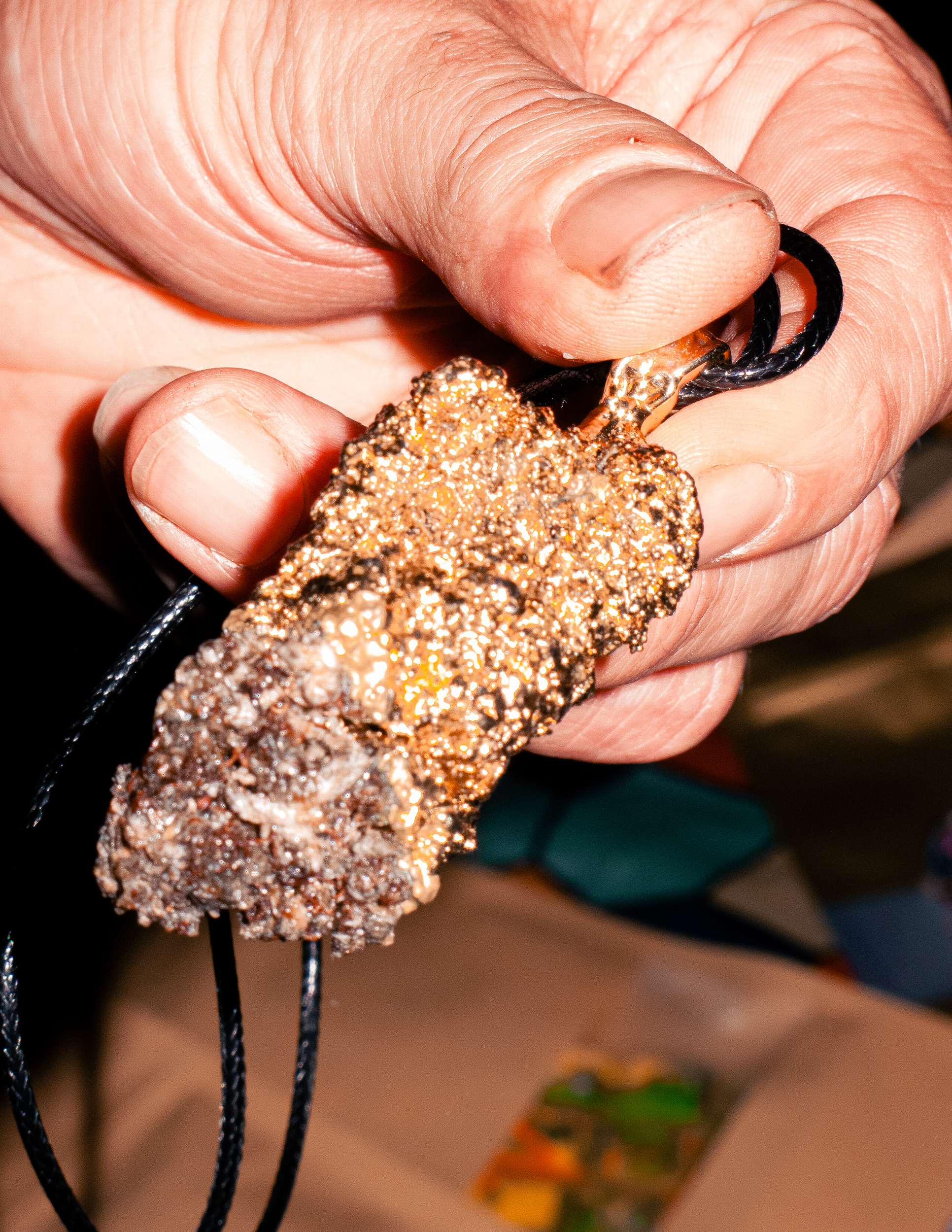 Cannabis gold necklace at Product Earth UK cannabis event.