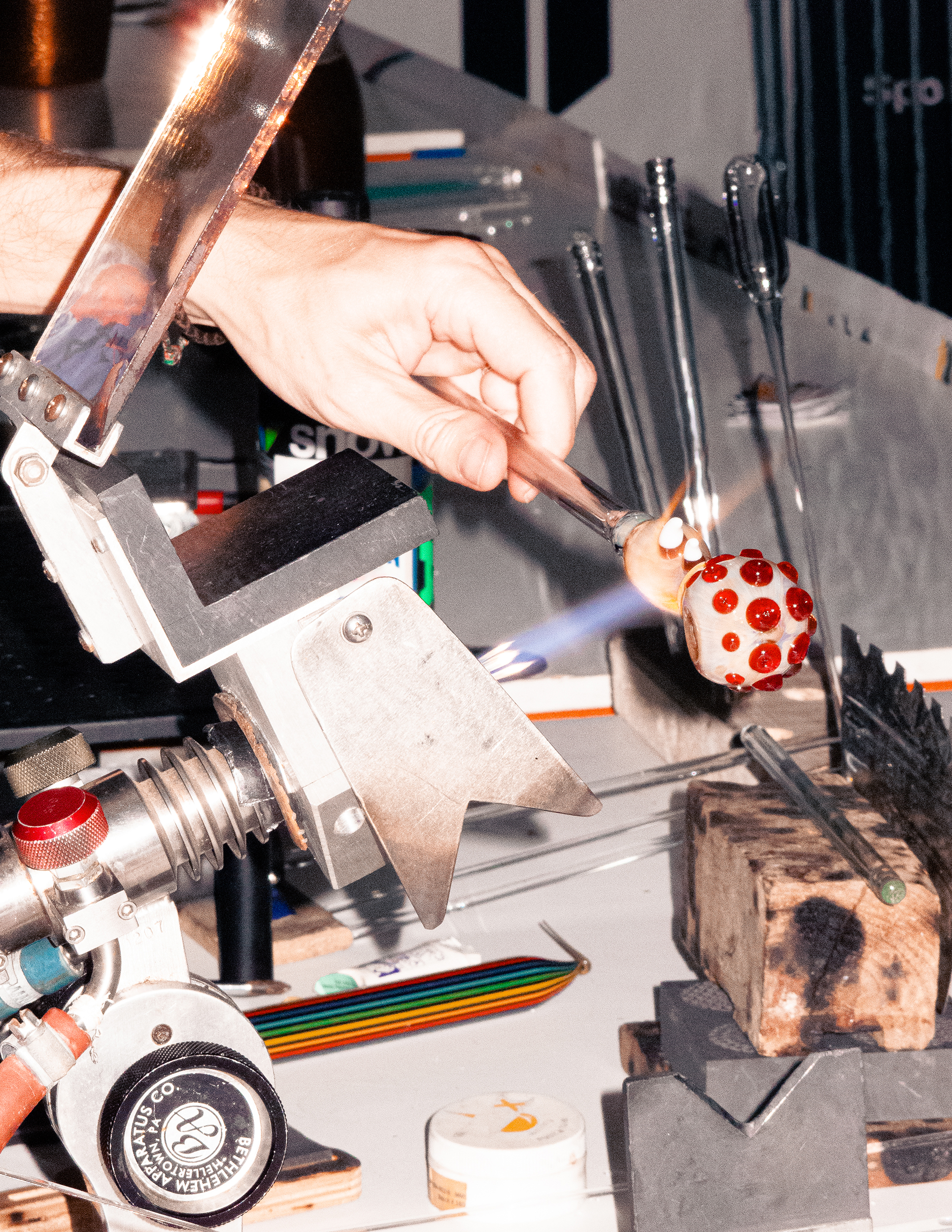 A person creating a glass weed pipe at Product Earth UK cannabis event.