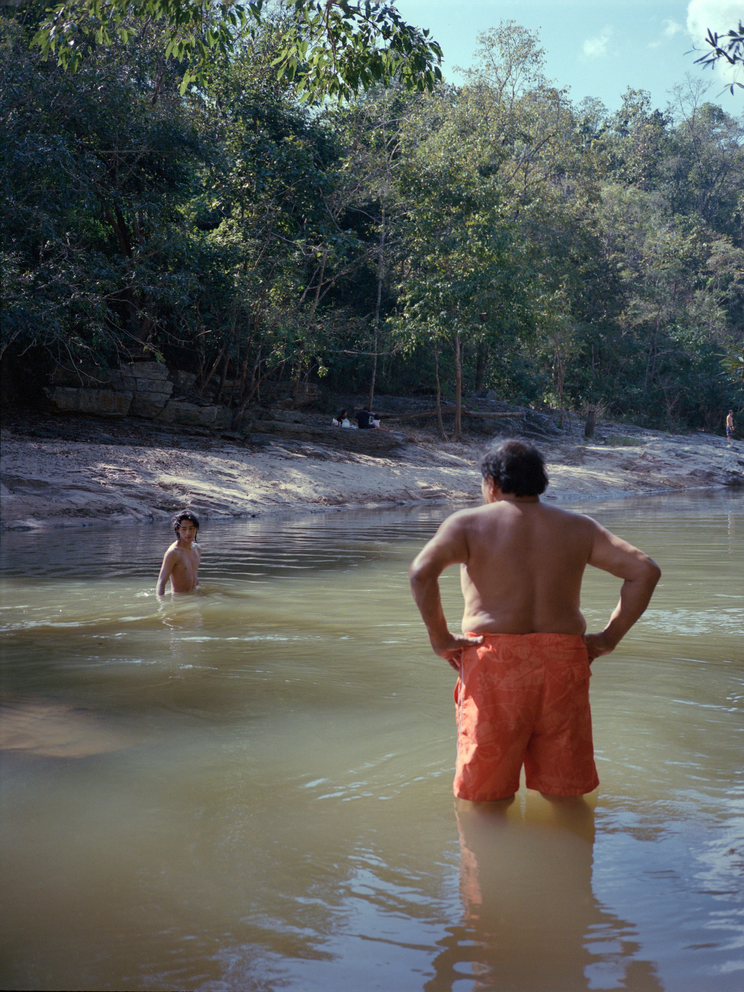 Men stand in Mekong River