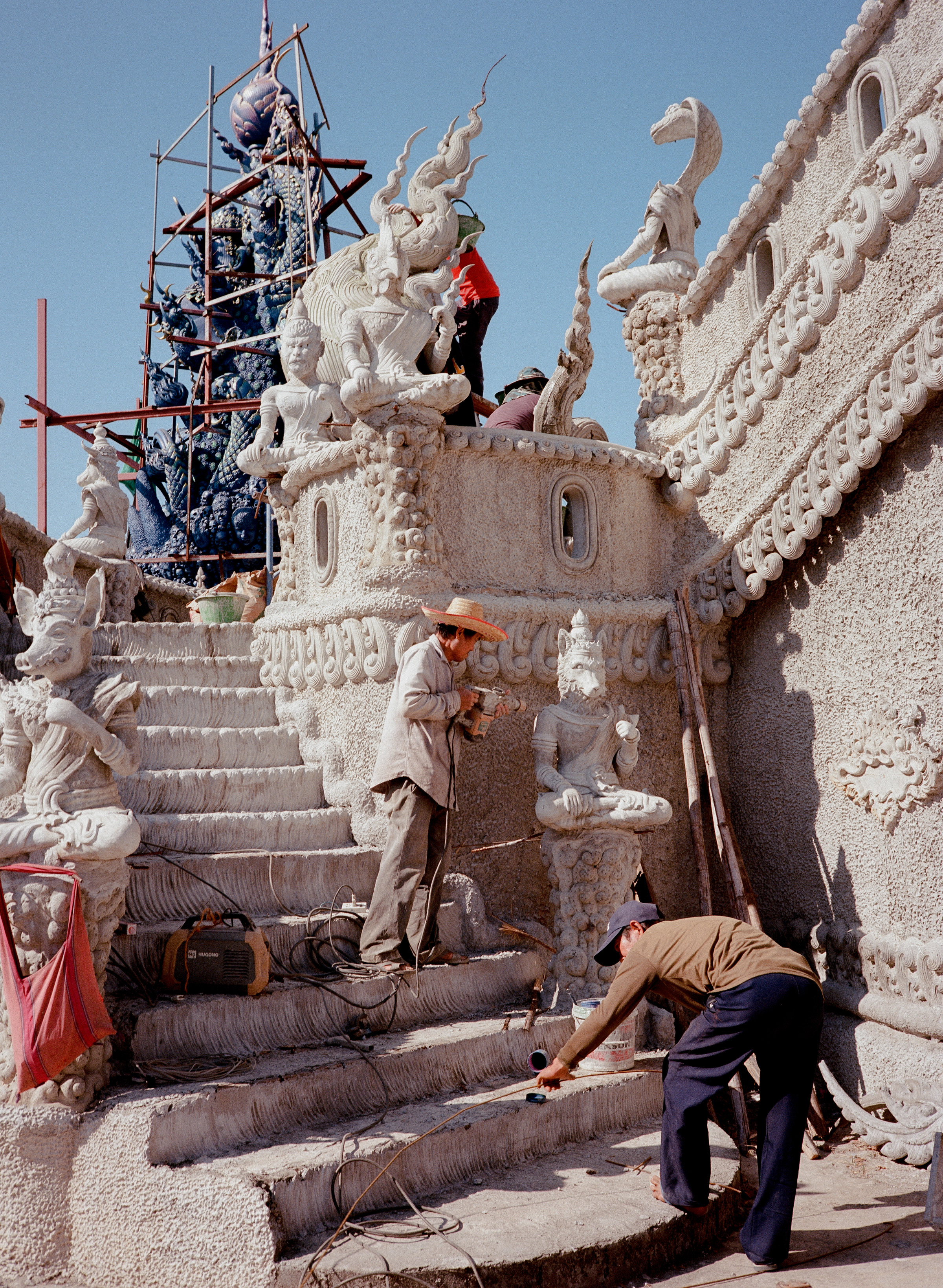 Workers building shrine