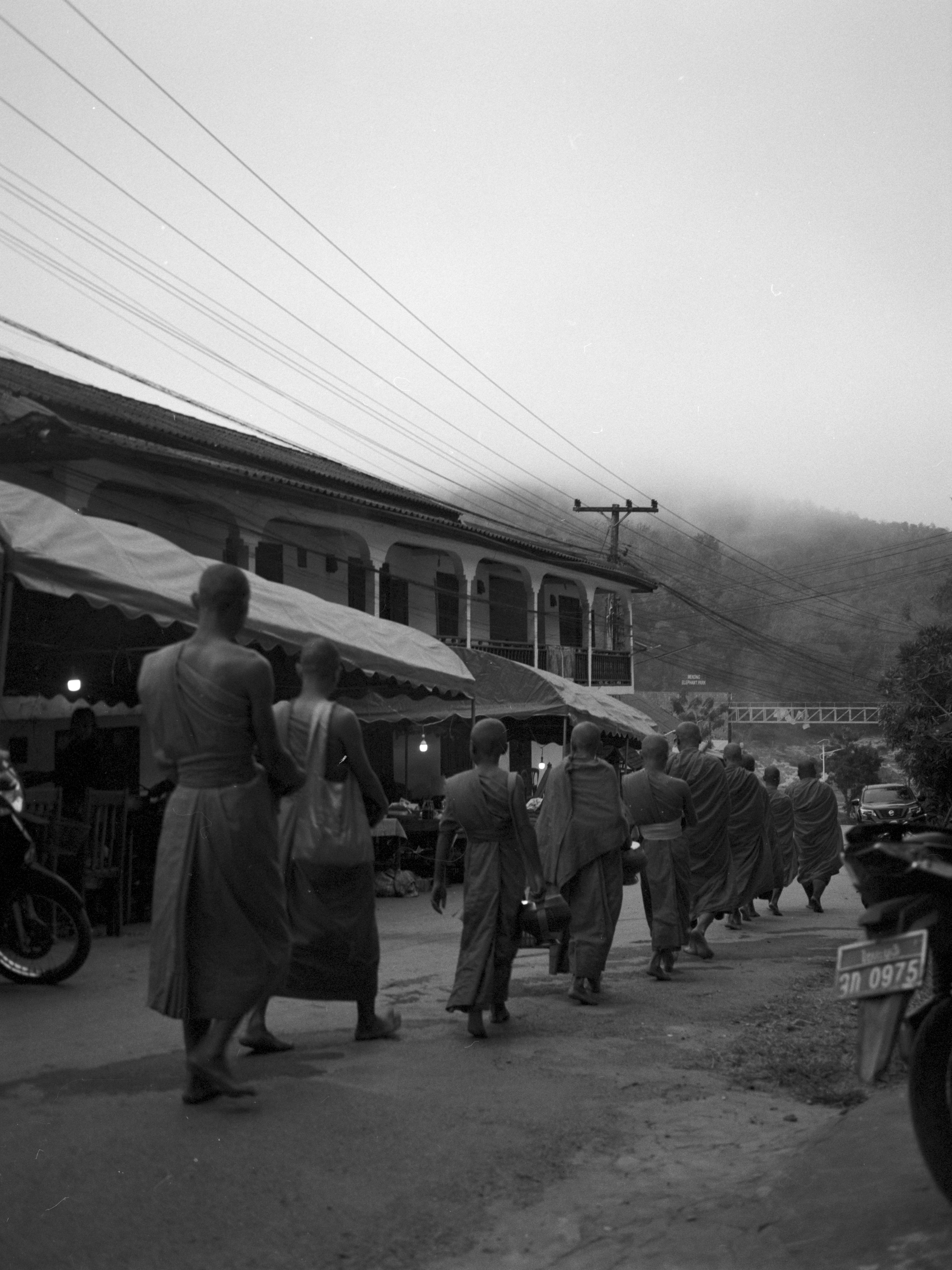 Monks walking in single file line