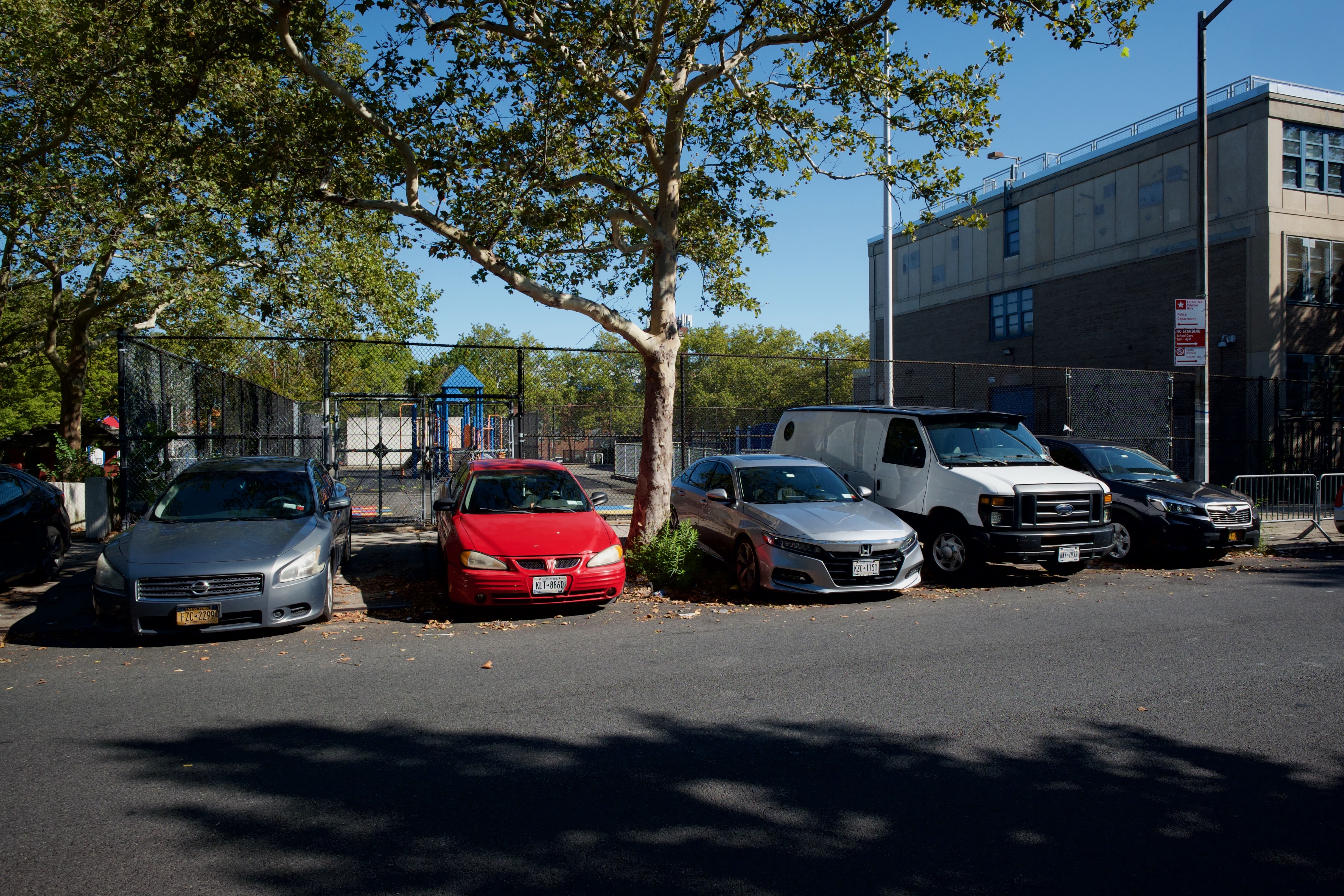 Cars parked on sidewalk