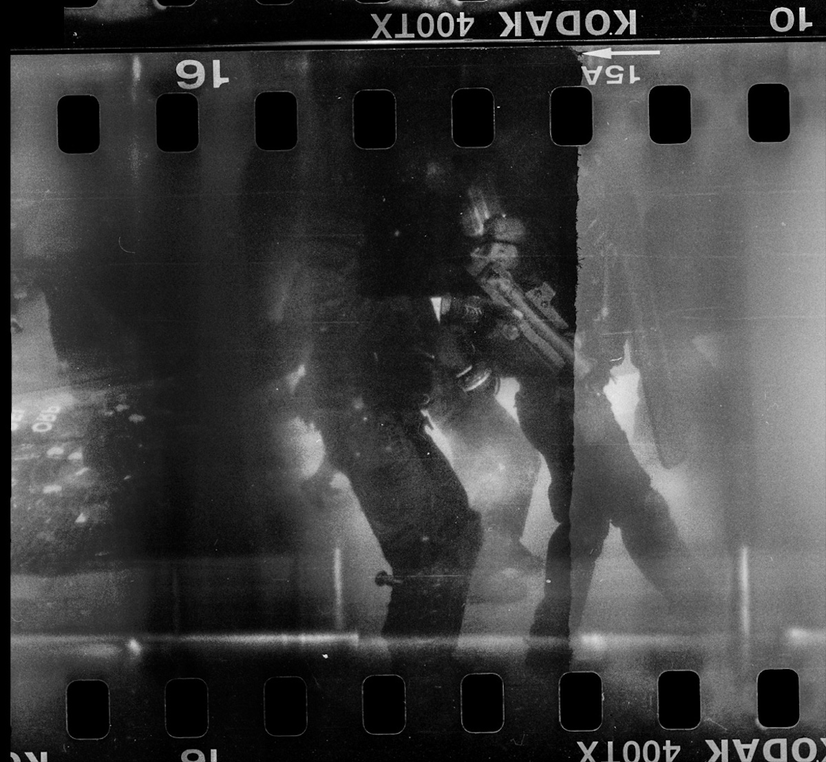 Steven Monteau photos with police weapons: black and white negative of police and their weapons