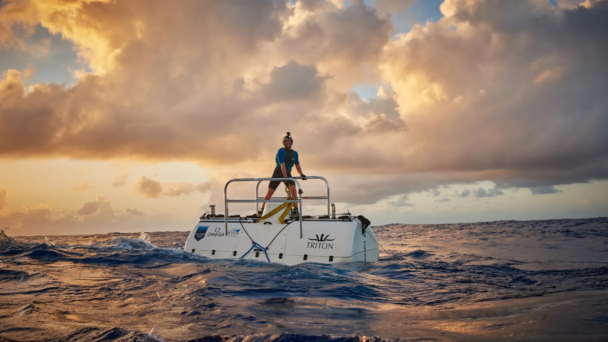 Tim Macondald standing on the submersible as a swimmer.jpeg