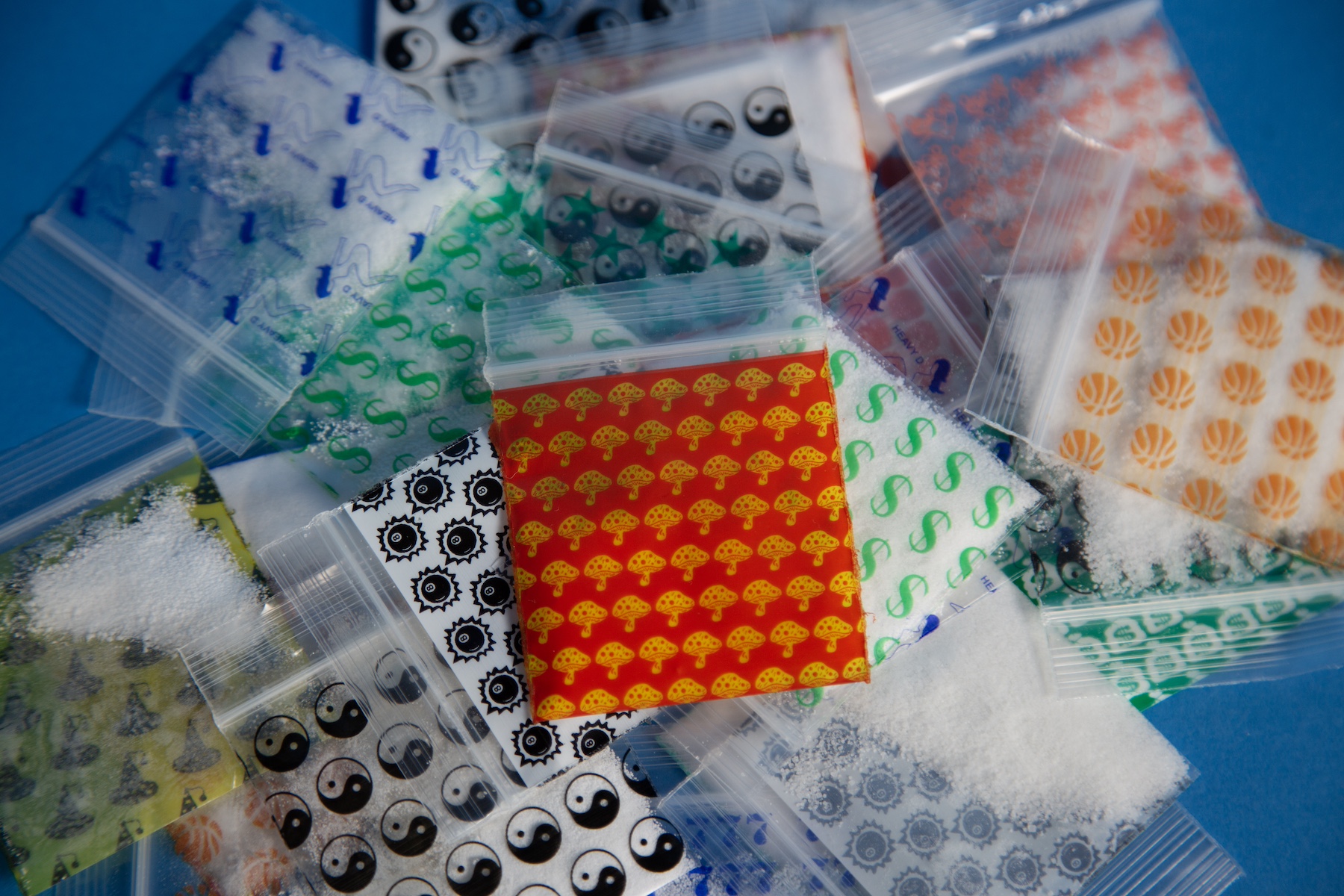 small plastic bags emblazoned with different logos