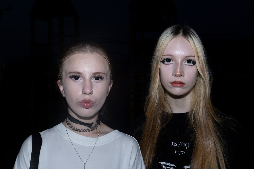 Two goth girls pose for a photo