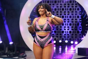 Willow Nightingale smiling on her way to the AEW ring.